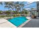 Screened pool with a fountain in an outdoor patio at 250 Shady Oaks Cir, Lake Mary, FL 32746