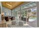 Bright sun room overlooking pool and outdoor seating area at 250 Shady Oaks Cir, Lake Mary, FL 32746