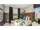 Cozy bedroom showcasing a playful design, comfortable furnishings, and natural light at 2572 Penguin Blvd, Davenport, FL 33837