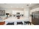 Modern kitchen featuring stainless steel appliances, a large island, and white cabinetry at 2572 Penguin Blvd, Davenport, FL 33837
