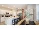 Eat-in kitchen with stainless steel appliances, ample counter space, a large island, and a dining area at 2572 Penguin Blvd, Davenport, FL 33837