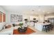 Open concept living room with a kitchen, stainless appliances, and a cozy seating area at 2572 Penguin Blvd, Davenport, FL 33837