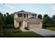 Charming two-story home with a two-car garage and beautifully landscaped front yard at 2783 San Marco Way, Winter Haven, FL 33884