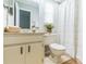 Cozy bathroom with shower and tub combination, white vanity, and a bright sunny window at 2839 Tamarack Trl, Apopka, FL 32703