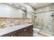 Nicely remodeled bathroom with a tiled shower, elegant vanity and natural light at 2839 Tamarack Trl, Apopka, FL 32703
