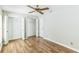 Bedroom with hardwood floors, ceiling fan and double closet at 2839 Tamarack Trl, Apopka, FL 32703