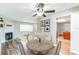 Charming dining room featuring a wooden table, fireplace, and hardwood floors at 2839 Tamarack Trl, Apopka, FL 32703