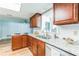 Bright kitchen features granite countertops, stainless steel appliances, window view, and wood cabinets at 2839 Tamarack Trl, Apopka, FL 32703