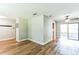 Spacious living area featuring beautiful hardwood floors, ceiling fan and access to additional rooms at 2839 Tamarack Trl, Apopka, FL 32703