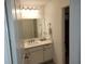 Well-lit bathroom features a sleek vanity and ample countertop space at 3020 Water Sprite St, Orlando, FL 32808