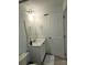 Well-lit bathroom featuring a white vanity with a mirror and a door to the right at 3020 Water Sprite St, Orlando, FL 32808
