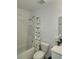 Bathroom with a shower and bathtub, a patterned curtain, and a white toilet at 3020 Water Sprite St, Orlando, FL 32808