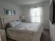 Bright bedroom featuring a comfortable bed, natural light, and a TV at 3020 Water Sprite St, Orlando, FL 32808