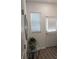 Bright hallway with wood-look flooring, neutral walls, and a decorative mirror and table for a welcoming ambiance at 3020 Water Sprite St, Orlando, FL 32808