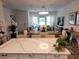 Spacious open-concept home with a well-equipped kitchen, dining area, and cozy living room for relaxation and gatherings at 3020 Water Sprite St, Orlando, FL 32808
