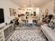 Bright, open living space with a modern kitchen, dining area, and living room for seamless entertaining and comfortable living at 3020 Water Sprite St, Orlando, FL 32808