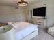 Comfortable main bedroom with TV and dresser, providing a relaxing retreat at 3020 Water Sprite St, Orlando, FL 32808