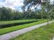 Exterior view of the green space of a small pond at 3020 Water Sprite St, Orlando, FL 32808