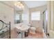 Small bathroom featuring a pedestal sink, tile floors, and light fixtures at 3225 Hargill Dr, Orlando, FL 32806
