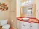 Charming bathroom with vanity, mirror, and lighting at 3225 Hargill Dr, Orlando, FL 32806