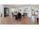 Elegant dining room with stylish table and chairs adjacent to kitchen and living room at 3225 Hargill Dr, Orlando, FL 32806