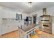 Updated kitchen with stainless steel appliances, granite countertops, and custom island at 3225 Hargill Dr, Orlando, FL 32806