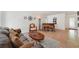 Spacious living area with a classic piano, comfortable seating, and an elegant area rug at 3225 Hargill Dr, Orlando, FL 32806