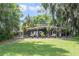 Charming backyard with well-manicured lawn and relaxing covered patio at 3225 Hargill Dr, Orlando, FL 32806