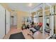 This workout room features various exercise machines, weights, mirrors and tile floors at 3225 Hargill Dr, Orlando, FL 32806