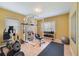 Workout room includes exercise bike, weight rack, barbell and workout bench at 3225 Hargill Dr, Orlando, FL 32806