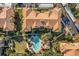 Aerial view of a community featuring a pool, lush greenery, and building at 3314 Robert Trent Jones Dr # 308, Orlando, FL 32835