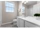 Bright bathroom featuring a large mirror, white vanity, and tub-shower combination at 3314 Robert Trent Jones Dr # 308, Orlando, FL 32835
