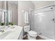 Bathroom featuring a glass shower and neutral-toned tile flooring at 3314 Robert Trent Jones Dr # 308, Orlando, FL 32835