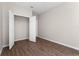 Bedroom featuring vinyl floors, a closet with open doors, and neutral wall color at 3314 Robert Trent Jones Dr # 308, Orlando, FL 32835