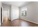 Cozy bedroom featuring wood-style floors, a double door closet, and natural light from the window at 3314 Robert Trent Jones Dr # 308, Orlando, FL 32835