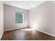 This bedroom is bright and sunny and features wood-look flooring at 3314 Robert Trent Jones Dr # 308, Orlando, FL 32835