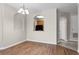 Hardwood dining area features arch to kitchen, modern lighting and natural light at 3314 Robert Trent Jones Dr # 308, Orlando, FL 32835
