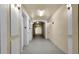 Hallway access to elevators with decorative lighting and neutral tones at 3314 Robert Trent Jones Dr # 308, Orlando, FL 32835