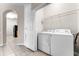 Laundry room area with functional appliances with neutral flooring and wall at 3314 Robert Trent Jones Dr # 308, Orlando, FL 32835