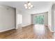 Spacious living room with hardwood floors and balcony access for an open feel at 3314 Robert Trent Jones Dr # 308, Orlando, FL 32835