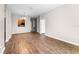 Open-concept living room featuring hardwood floors and natural light, perfect for entertaining at 3314 Robert Trent Jones Dr # 308, Orlando, FL 32835