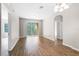 Spacious living room with hardwood floors and large windows providing plenty of natural light at 3314 Robert Trent Jones Dr # 308, Orlando, FL 32835