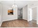 Bright living room with hardwood floors and view of the kitchen, ideal for Gathering gatherings at 3314 Robert Trent Jones Dr # 308, Orlando, FL 32835