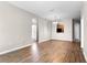 Open living area with hardwood floors, archways and ample space for various uses at 3314 Robert Trent Jones Dr # 308, Orlando, FL 32835
