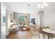 Bright living room with hardwood floors, large windows, and stylish decor, ideal for relaxation at 3314 Robert Trent Jones Dr # 308, Orlando, FL 32835