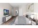 Serene main bedroom featuring hardwood floors, soft lighting and ample closet space at 3314 Robert Trent Jones Dr # 308, Orlando, FL 32835