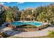 Beautiful community pool with palm trees and lounge chairs, a perfect oasis at 3314 Robert Trent Jones Dr # 308, Orlando, FL 32835