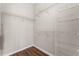 Inside the walk-in closet with wooden-style floors and wire shelving for organized storage at 3314 Robert Trent Jones Dr # 308, Orlando, FL 32835