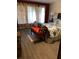 Comfortable bedroom featuring new laminate flooring and ample natural light at 333 Lake Howard Nw Dr # 302B, Winter Haven, FL 33880