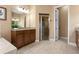 Elegant bathroom featuring a granite countertop, tiled floor, and glass-enclosed shower with neutral finishes at 36813 Barrington Dr, Eustis, FL 32736